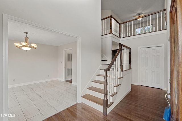 945 Dashaway Rd, Chuckey, TN 37641 - foyer entrance with a chandelier, a towering ceiling, stairway, and ceiling fan