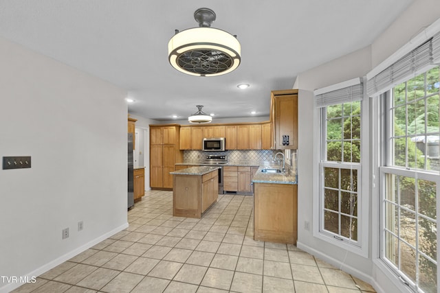 945 Dashaway Rd, Chuckey, TN 37641 - kitchen featuring stainless steel appliances, tasteful backsplash, a center island, light tile patterned floors, and recessed lighting