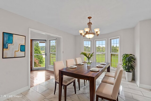 945 Dashaway Rd, Chuckey, TN 37641 - dining space with plenty of natural light and a chandelier