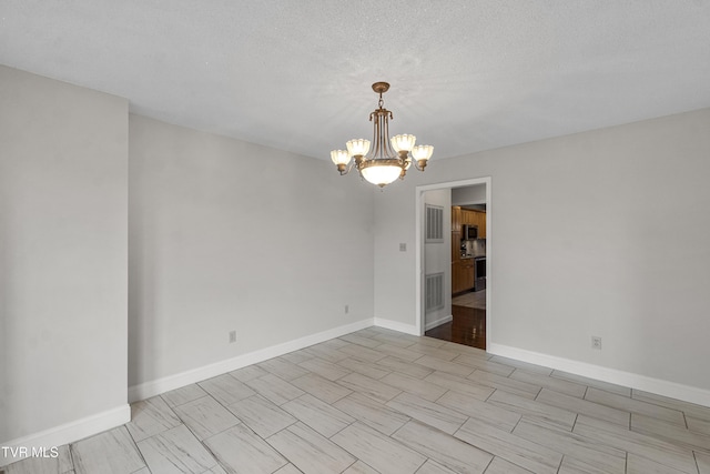 945 Dashaway Rd, Chuckey, TN 37641 - empty room featuring a chandelier and baseboards