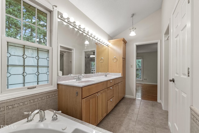 945 Dashaway Rd, Chuckey, TN 37641 - bathroom featuring lofted ceiling, tile patterned flooring, double vanity, and a bath