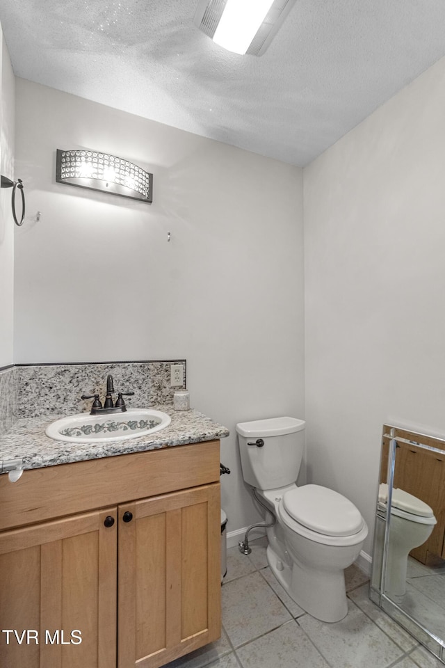 945 Dashaway Rd, Chuckey, TN 37641 - bathroom with vanity, a textured ceiling, and tile patterned flooring