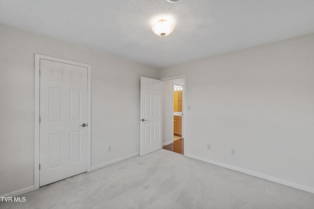 945 Dashaway Rd, Chuckey, TN 37641 - unfurnished bedroom featuring carpet floors and a textured ceiling