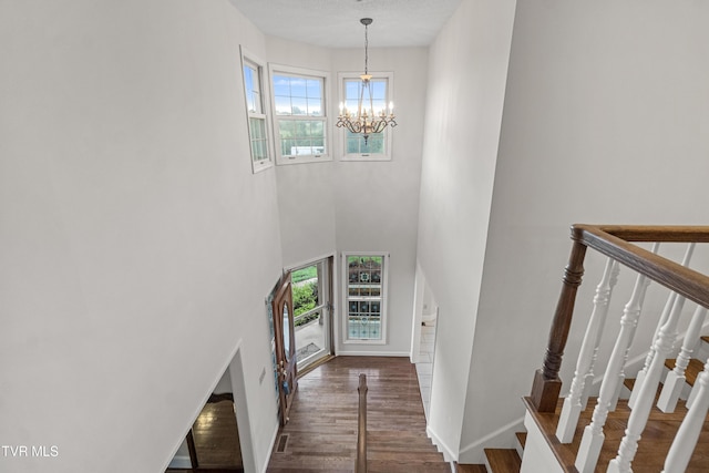 945 Dashaway Rd, Chuckey, TN 37641 - entrance foyer with healthy amount of natural light, a chandelier, wood finished floors, a towering ceiling, and stairs
