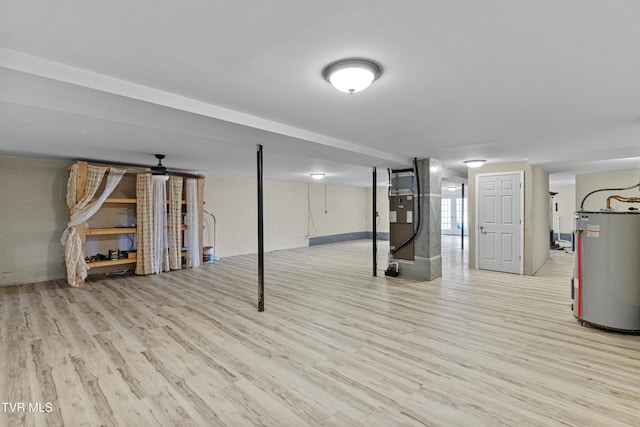 945 Dashaway Rd, Chuckey, TN 37641 - below grade area featuring water heater, light wood-type flooring, and heating unit