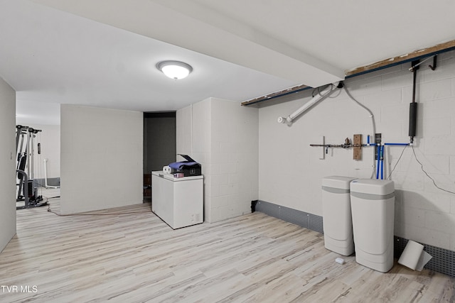 945 Dashaway Rd, Chuckey, TN 37641 - finished basement with light wood finished floors, washer and dryer, concrete block wall, and a water softener