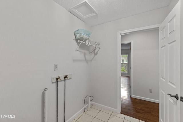 945 Dashaway Rd, Chuckey, TN 37641 - laundry room with attic access, washer hookup, a textured ceiling, and light tile patterned floors