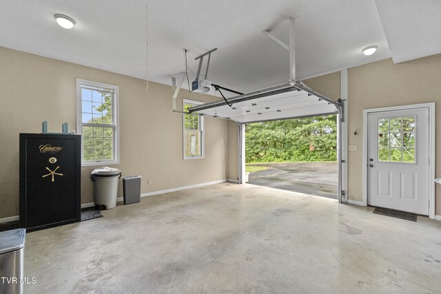 945 Dashaway Rd, Chuckey, TN 37641 - garage with a garage door opener and baseboards