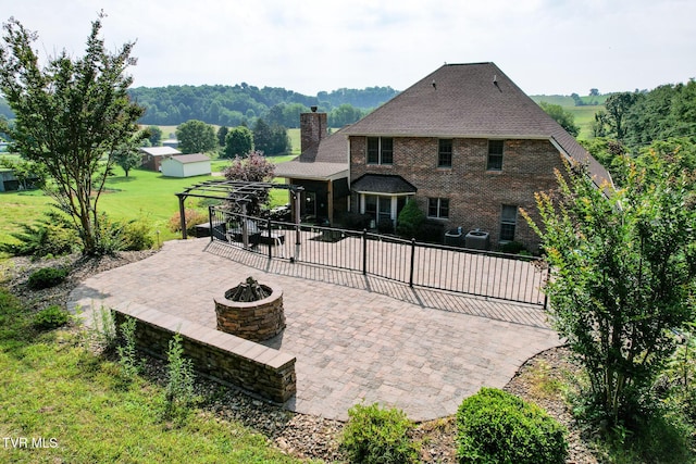 945 Dashaway Rd, Chuckey, TN 37641 - view of patio featuring an outdoor fire pit