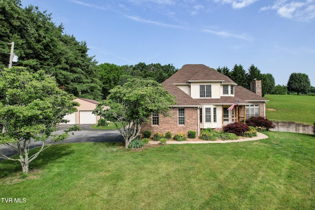 945 Dashaway Rd, Chuckey, TN 37641 - traditional home featuring a chimney, brick siding, an outdoor structure, a front lawn, and a detached garage