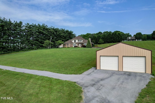 945 Dashaway Rd, Chuckey, TN 37641 - view of grassy yard featuring an outbuilding and a detached garage