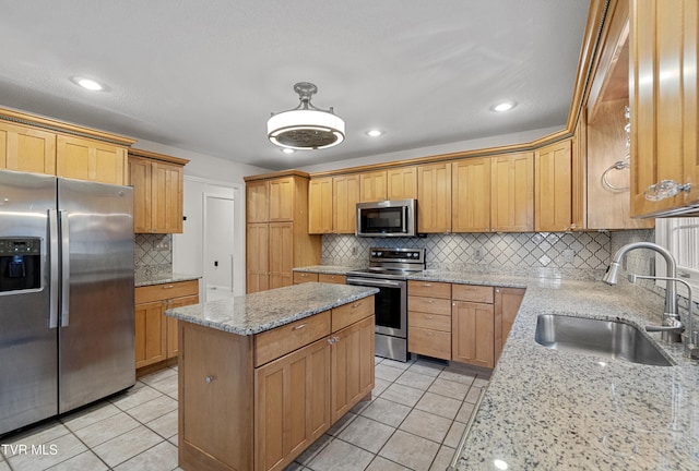 945 Dashaway Rd, Chuckey, TN 37641 - kitchen with appliances with stainless steel finishes, backsplash, light tile patterned flooring, light stone countertops, and a center island