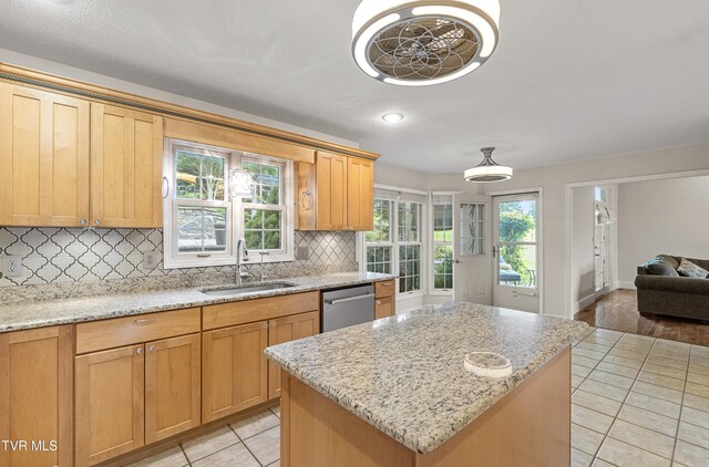 945 Dashaway Rd, Chuckey, TN 37641 - kitchen with stainless steel dishwasher, tasteful backsplash, light tile patterned floors, open floor plan, and a center island
