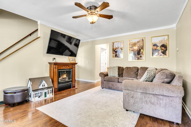 208 Hallock Pl, Abingdon, VA 24210 - living area featuring crown molding, wood finished floors, a ceiling fan, and a lit fireplace