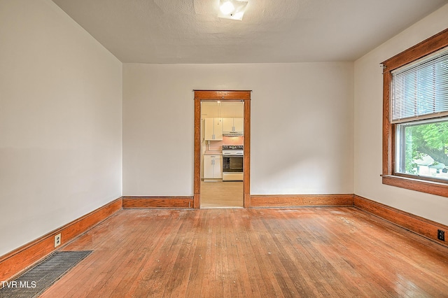 1149 Moorland Ave, Bristol, VA 24201 - spare room featuring hardwood / wood-style flooring and baseboards
