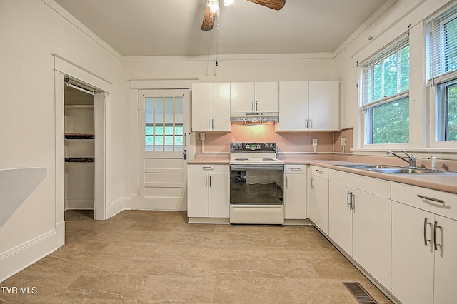 1149 Moorland Ave, Bristol, VA 24201 - kitchen with electric stove, range hood, white cabinets, a ceiling fan, and light countertops