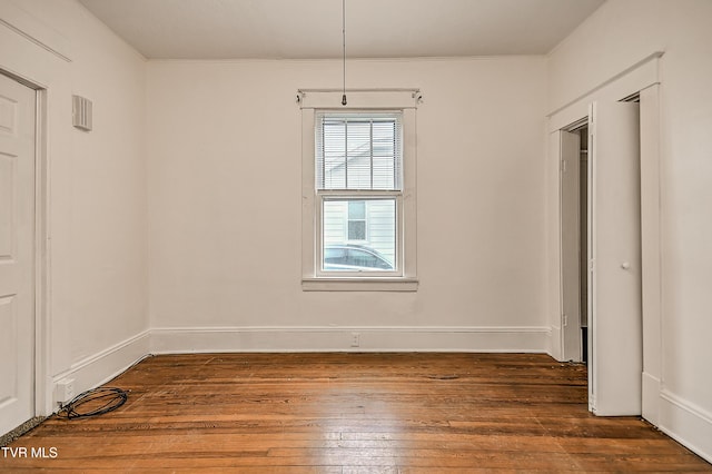 1149 Moorland Ave, Bristol, VA 24201 - unfurnished dining area with dark wood-type flooring and crown molding