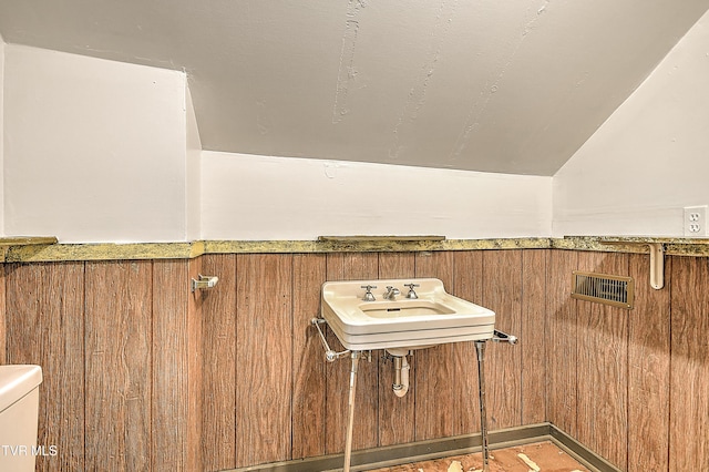 1149 Moorland Ave, Bristol, VA 24201 - bathroom with vaulted ceiling and wood walls