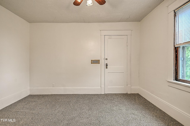 1149 Moorland Ave, Bristol, VA 24201 - empty room with carpet floors, ceiling fan, plenty of natural light, and a textured ceiling
