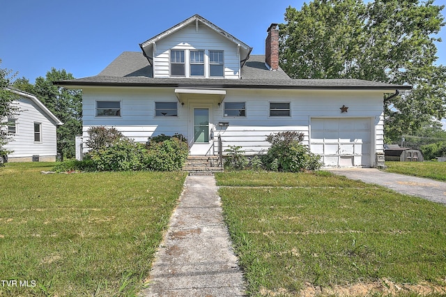 1149 Moorland Ave, Bristol, VA 24201 - view of front facade with a chimney, a front lawn, driveway, and a garage