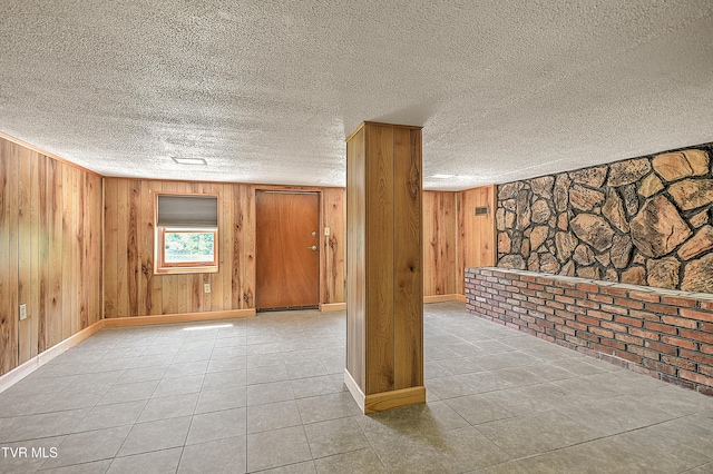 307 Tween Hills Rd, Bristol, TN 37620 - tiled spare room with wood walls and a textured ceiling
