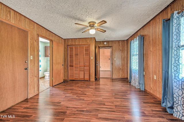 307 Tween Hills Rd, Bristol, TN 37620 - entryway featuring a ceiling fan, wooden walls, wood finished floors, and a textured ceiling