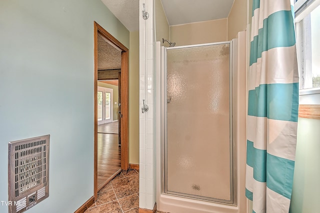 307 Tween Hills Rd, Bristol, TN 37620 - full bathroom featuring heating unit, a shower stall, and tile patterned flooring