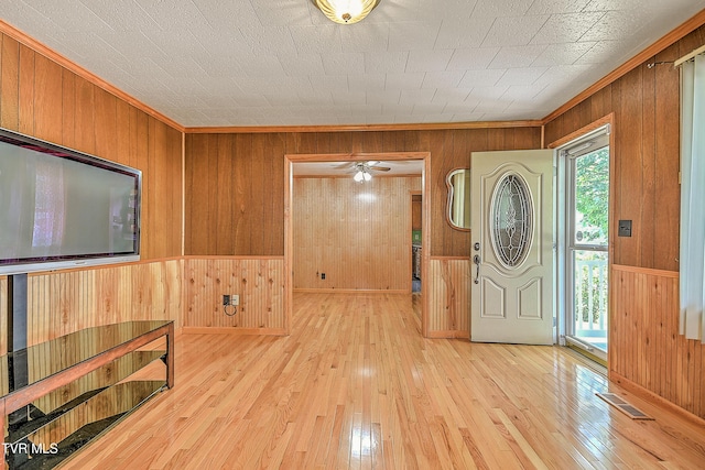 307 Tween Hills Rd, Bristol, TN 37620 - foyer entrance featuring wood walls, ceiling fan, hardwood / wood-style flooring, and ornamental molding