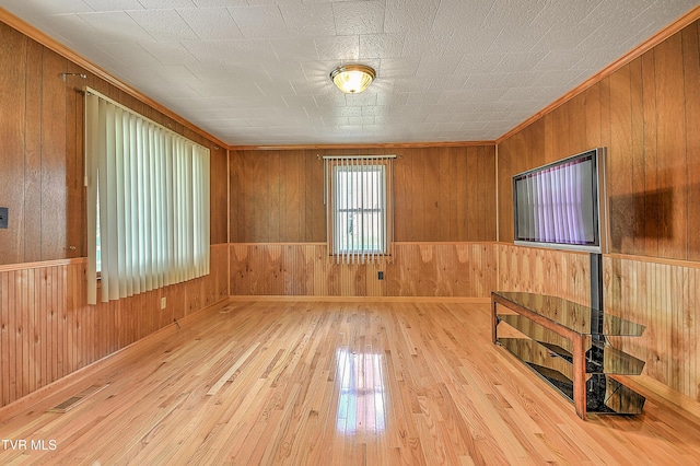 307 Tween Hills Rd, Bristol, TN 37620 - unfurnished room featuring hardwood / wood-style floors, wood walls, and ornamental molding