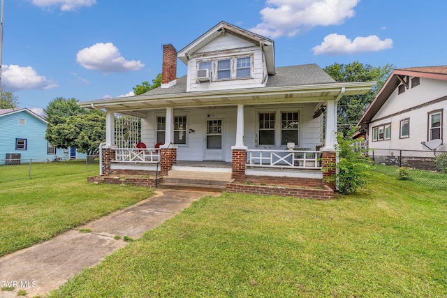 1411 E Unaka Ave, Johnson City, TN 37601 - bungalow-style house with a chimney, covered porch, cooling unit, and roof with shingles