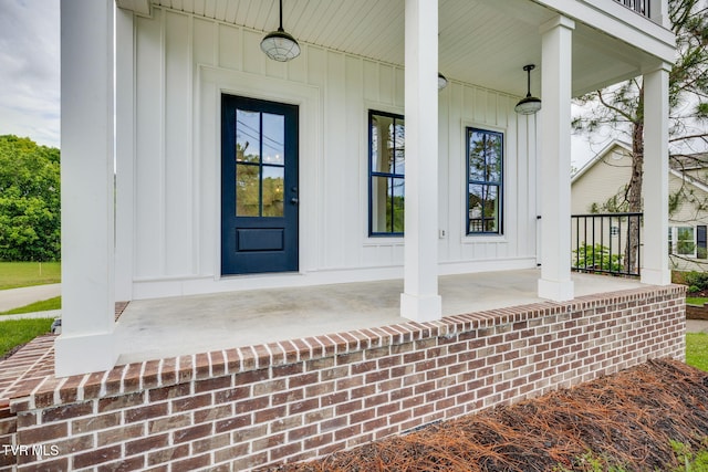 2009 Idle Hour Rd, Kingsport, TN 37660 - view of exterior entry featuring covered porch and board and batten siding