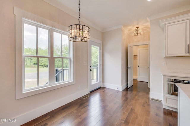 2009 Idle Hour Rd, Kingsport, TN 37660 - unfurnished dining area featuring a chandelier, crown molding, and dark wood finished floors
