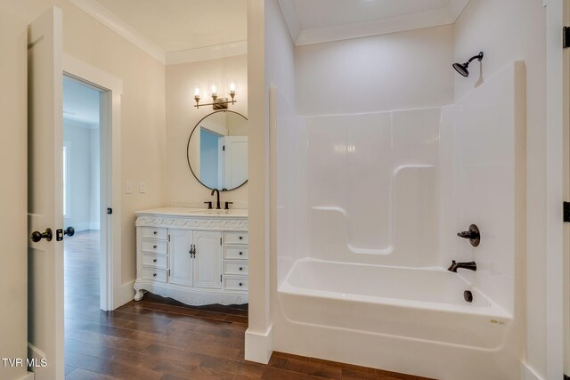 2009 Idle Hour Rd, Kingsport, TN 37660 - full bathroom with wood finished floors, ornamental molding, vanity, and washtub / shower combination
