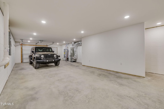2009 Idle Hour Rd, Kingsport, TN 37660 - garage with electric water heater, recessed lighting, and concrete block wall