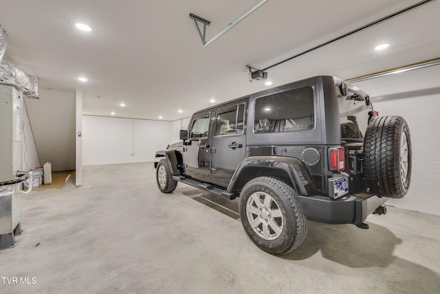 2009 Idle Hour Rd, Kingsport, TN 37660 - garage featuring a garage door opener and recessed lighting