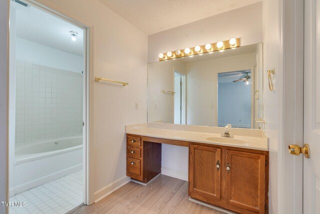 256 S Creek Ct, Kingsport, TN 37663 - bathroom with vanity, wood finished floors, and a textured ceiling