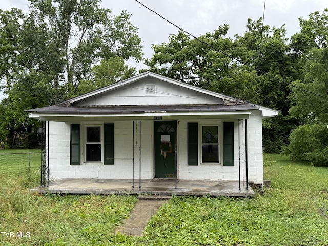 1741 Dunlap St, Bristol, VA 24201 - bungalow-style house featuring concrete block siding, a porch, and a front yard