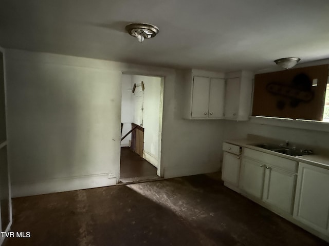 1741 Dunlap St, Bristol, VA 24201 - kitchen featuring concrete floors and white cabinetry