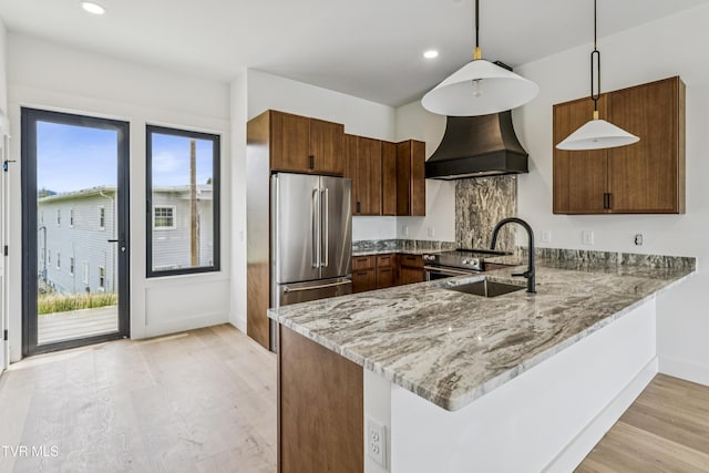 1533 Pactolas Rd Unit 107, Johnson City, TN 37604 - kitchen with appliances with stainless steel finishes, a peninsula, light stone counters, healthy amount of natural light, and recessed lighting