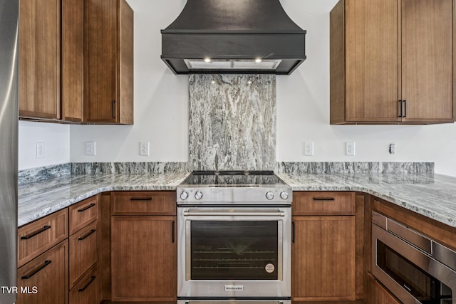 1533 Pactolas Rd Unit 107, Johnson City, TN 37604 - kitchen with stainless steel appliances, exhaust hood, and light stone countertops