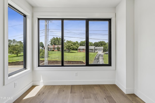 1533 Pactolas Rd Unit 107, Johnson City, TN 37604 - spare room featuring healthy amount of natural light and wood finished floors
