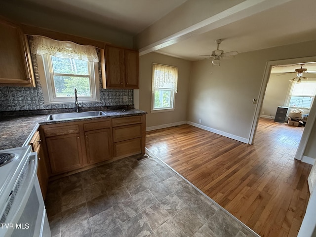 609 W D St, Elizabethton, TN 37643 - kitchen with electric range, plenty of natural light, decorative backsplash, and dark countertops