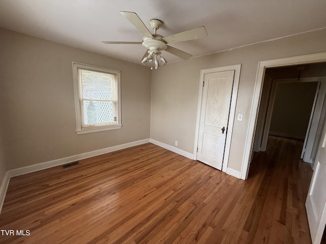 609 W D St, Elizabethton, TN 37643 - unfurnished bedroom with wood finished floors and ceiling fan