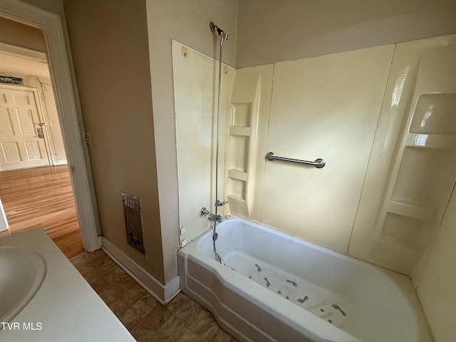 609 W D St, Elizabethton, TN 37643 - full bath featuring tub / shower combination, vanity, and heating unit