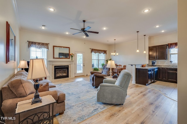 1645 Old Stagecoach Rd, Jonesborough, TN 37659 - living area featuring a tiled fireplace, ornamental molding, recessed lighting, a ceiling fan, and light wood-style floors