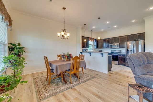 1645 Old Stagecoach Rd, Jonesborough, TN 37659 - dining space with light wood-style flooring, a chandelier, crown molding, and recessed lighting