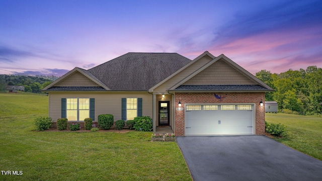 1645 Old Stagecoach Rd, Jonesborough, TN 37659 - view of front of home featuring driveway, a yard, an attached garage, brick siding, and a shingled roof