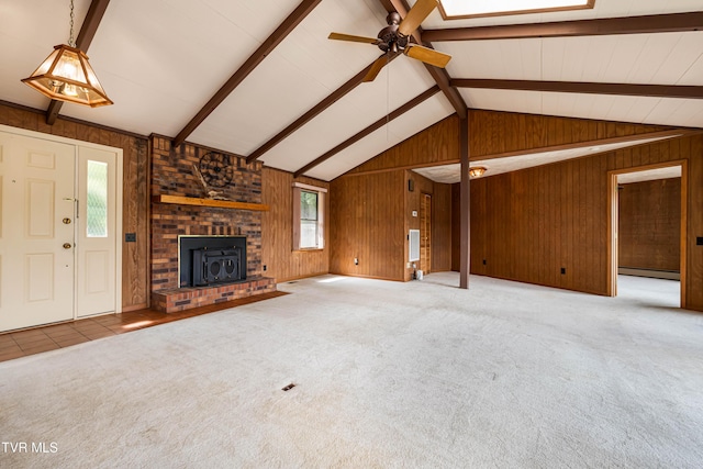 22627 Montego Bay Rd, Abingdon, VA 24211 - unfurnished living room with wood walls, a ceiling fan, a fireplace, carpet flooring, and a baseboard heating unit