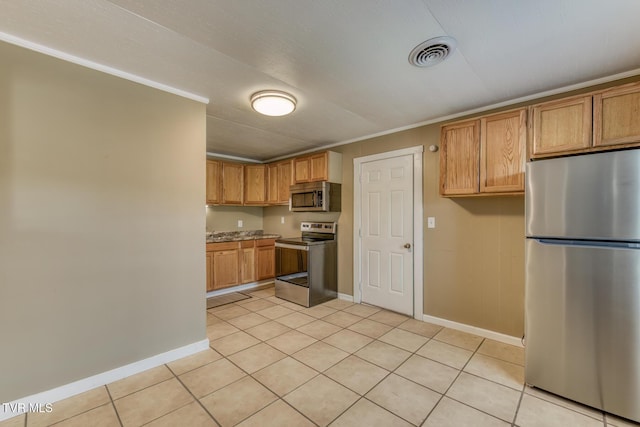 2642 Broad St, Bristol, TN 37620 - kitchen featuring stainless steel appliances, light tile patterned floors, crown molding, and brown cabinets