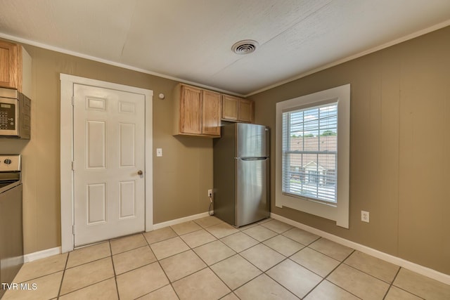 2642 Broad St, Bristol, TN 37620 - kitchen featuring stainless steel appliances, crown molding, and light tile patterned floors
